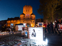 Nearly a hundred Iranian activists take part in a candlelight vigil for the second anniversary of Mahsa Amini's death in Cologne, Germany, o...