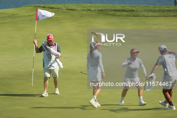 GAINESVILLE, VIRGINIA - SEPTEMBER 14: Megan Khang of the United States celebrates with her teammates after her putt on the 11th green during...