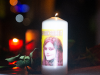 Nearly a hundred Iranian activists take part in a candlelight vigil for the second anniversary of Mahsa Amini's death in Cologne, Germany, o...