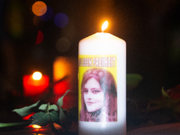 Nearly a hundred Iranian activists take part in a candlelight vigil for the second anniversary of Mahsa Amini's death in Cologne, Germany, o...