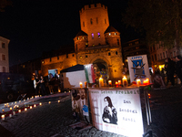 Nearly a hundred Iranian activists take part in a candlelight vigil for the second anniversary of Mahsa Amini's death in Cologne, Germany, o...