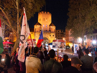 Nearly a hundred Iranian activists take part in a candlelight vigil for the second anniversary of Mahsa Amini's death in Cologne, Germany, o...