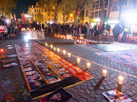 Nearly a hundred Iranian activists take part in a candlelight vigil for the second anniversary of Mahsa Amini's death in Cologne, Germany, o...