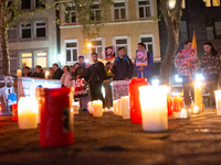 Nearly a hundred Iranian activists take part in a candlelight vigil for the second anniversary of Mahsa Amini's death in Cologne, Germany, o...