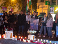 Nearly a hundred Iranian activists take part in a candlelight vigil for the second anniversary of Mahsa Amini's death in Cologne, Germany, o...