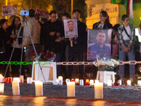 Nearly a hundred Iranian activists take part in a candlelight vigil for the second anniversary of Mahsa Amini's death in Cologne, Germany, o...