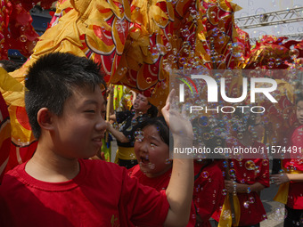 Members of the Chinese community in Sao Paulo, Brazil, gather in the city center to celebrate the Mid-Autumn Festival, an important cultural...