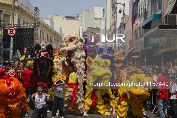 Members of the Chinese community in Sao Paulo, Brazil, gather in the city center to celebrate the Mid-Autumn Festival, an important cultural...