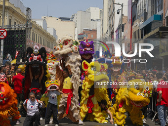 Members of the Chinese community in Sao Paulo, Brazil, gather in the city center to celebrate the Mid-Autumn Festival, an important cultural...