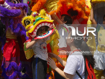 Members of the Chinese community in Sao Paulo, Brazil, gather in the city center to celebrate the Mid-Autumn Festival, an important cultural...