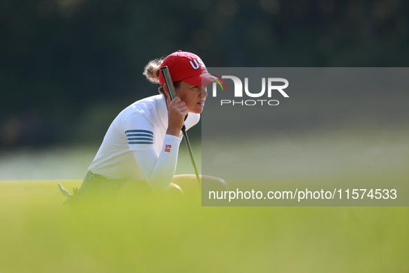 GAINESVILLE, VIRGINIA - SEPTEMBER 14: Sarah Schmelzel of the United States lines up her putt on the 11th green during Foursomes Matches on D...