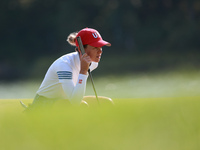 GAINESVILLE, VIRGINIA - SEPTEMBER 14: Sarah Schmelzel of the United States lines up her putt on the 11th green during Foursomes Matches on D...