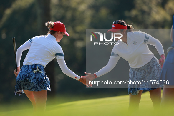 GAINESVILLE, VIRGINIA - SEPTEMBER 14: Sarah Schmelzel of the United States (L) celebrates her putt on the 11th green with teammate Lilia Vu...