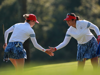 GAINESVILLE, VIRGINIA - SEPTEMBER 14: Sarah Schmelzel of the United States (L) celebrates her putt on the 11th green with teammate Lilia Vu...