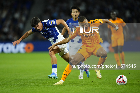 Kylian Mbappe centre-forward of Real Madrid and France and Aramburu of Real Sociedad and Spain compete for the ball during the La Liga match...