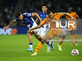 Kylian Mbappe centre-forward of Real Madrid and France and Aramburu of Real Sociedad and Spain compete for the ball during the La Liga match...