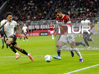 Theo Hernandez is in action during the Serie A match between AC Milan and Venezia FC in Milano, Italy, on September 14, 2024, at Stadio Gius...