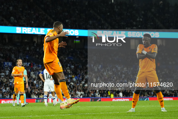 Kylian Mbappe centre-forward of Real Madrid and France celebrates with Vinicius Junior left winger of Real Madrid and Brazil after scoring h...