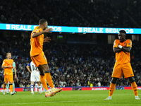 Kylian Mbappe centre-forward of Real Madrid and France celebrates with Vinicius Junior left winger of Real Madrid and Brazil after scoring h...