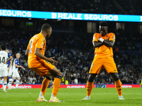 Kylian Mbappe centre-forward of Real Madrid and France celebrates with Vinicius Junior left winger of Real Madrid and Brazil after scoring h...