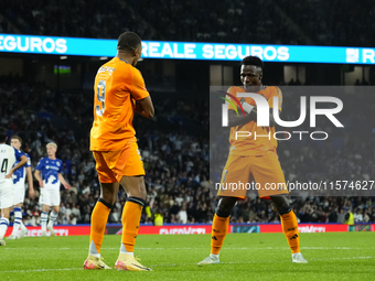 Kylian Mbappe centre-forward of Real Madrid and France celebrates with Vinicius Junior left winger of Real Madrid and Brazil after scoring h...