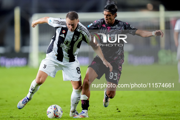 Youssef Maleh of Empoli FC and Teun Koopmeiners of Juventus FC compete for the ball during the Serie A Enilive match between Empoli FC and J...