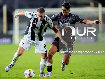 Youssef Maleh of Empoli FC and Teun Koopmeiners of Juventus FC compete for the ball during the Serie A Enilive match between Empoli FC and J...