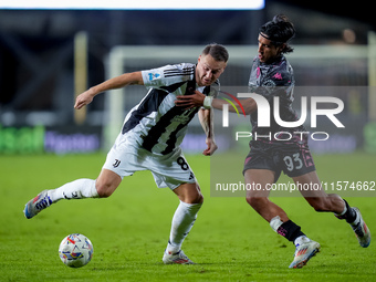 Youssef Maleh of Empoli FC and Teun Koopmeiners of Juventus FC compete for the ball during the Serie A Enilive match between Empoli FC and J...