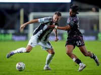 Youssef Maleh of Empoli FC and Teun Koopmeiners of Juventus FC compete for the ball during the Serie A Enilive match between Empoli FC and J...