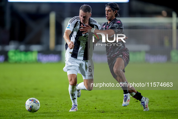 Youssef Maleh of Empoli FC and Teun Koopmeiners of Juventus FC compete for the ball during the Serie A Enilive match between Empoli FC and J...