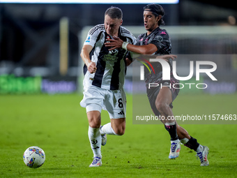 Youssef Maleh of Empoli FC and Teun Koopmeiners of Juventus FC compete for the ball during the Serie A Enilive match between Empoli FC and J...