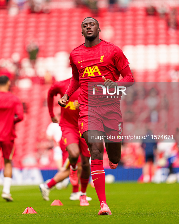 Liverpool's Ibrahima Konate warms up during the Premier League match between Liverpool and Nottingham Forest at Anfield in Liverpool, Englan...