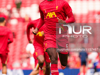 Liverpool's Ibrahima Konate warms up during the Premier League match between Liverpool and Nottingham Forest at Anfield in Liverpool, Englan...