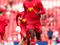 Liverpool's Ibrahima Konate warms up during the Premier League match between Liverpool and Nottingham Forest at Anfield in Liverpool, Englan...