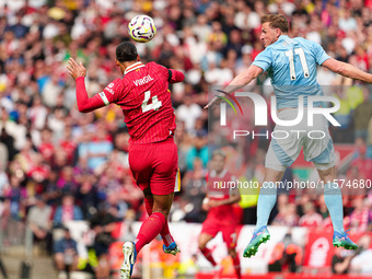 Chris Wood of Nottingham Forest challenges for a header with Liverpool's Virgil van Dijk during the Premier League match between Liverpool a...