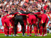 Liverpool's players huddle before the Premier League match between Liverpool and Nottingham Forest at Anfield in Liverpool, England, on Sept...