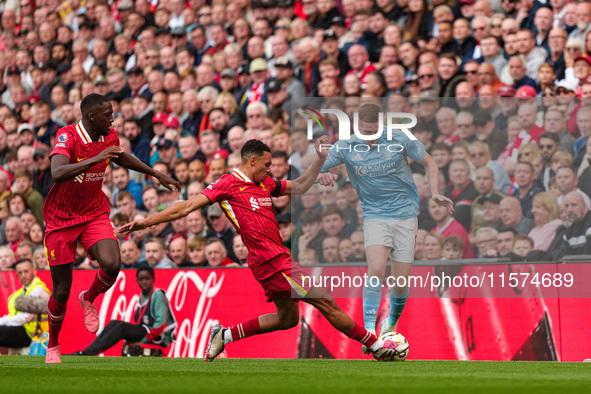 Elliot Anderson of Nottingham Forest is in action with Liverpool's Trent Alexander-Arnold during the Premier League match between Liverpool...