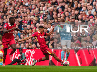 Elliot Anderson of Nottingham Forest is in action with Liverpool's Trent Alexander-Arnold during the Premier League match between Liverpool...