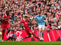 Elliot Anderson of Nottingham Forest is in action with Liverpool's Trent Alexander-Arnold during the Premier League match between Liverpool...