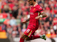 Liverpool's Dominik Szoboszlai is in action during the Premier League match between Liverpool and Nottingham Forest at Anfield in Liverpool,...