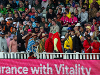 A fancy dress conga takes place in the Hollies stand during the final between Somerset CCC and Gloucestershire CCC at the Vitality Blast Fin...