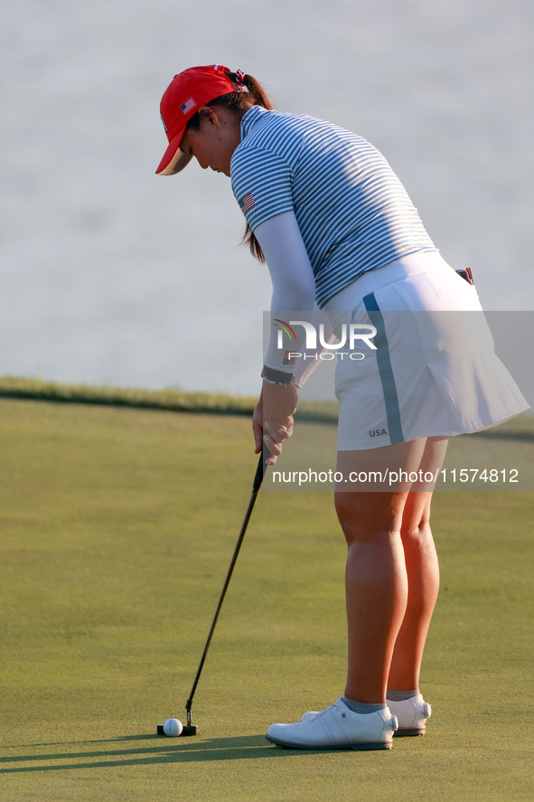 GAINESVILLE, VIRGINIA - SEPTEMBER 14: Allisen Corpuz of the United States putts on the 18th green during Day Two of the Solheim Cup at Rober...