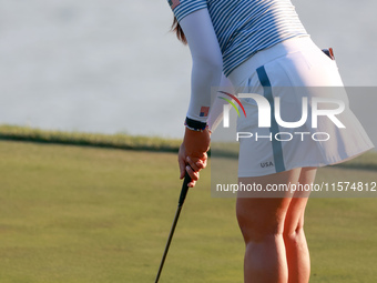 GAINESVILLE, VIRGINIA - SEPTEMBER 14: Allisen Corpuz of the United States putts on the 18th green during Day Two of the Solheim Cup at Rober...