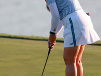 GAINESVILLE, VIRGINIA - SEPTEMBER 14: Allisen Corpuz of the United States putts on the 18th green during Day Two of the Solheim Cup at Rober...