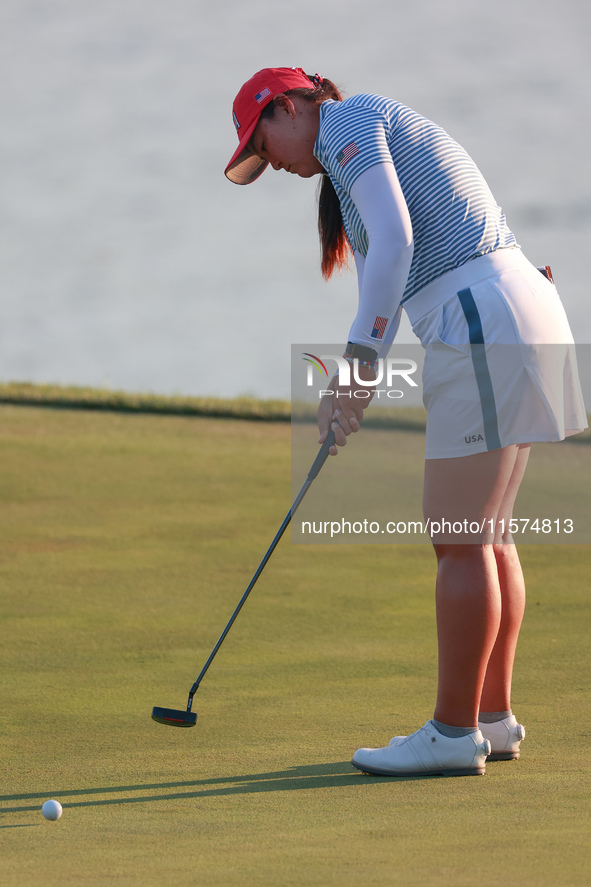 GAINESVILLE, VIRGINIA - SEPTEMBER 14: Allisen Corpuz of the United States putts on the 18th green during Day Two of the Solheim Cup at Rober...