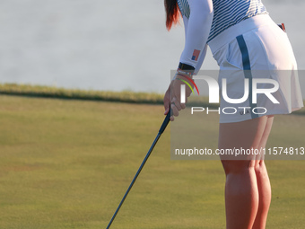 GAINESVILLE, VIRGINIA - SEPTEMBER 14: Allisen Corpuz of the United States putts on the 18th green during Day Two of the Solheim Cup at Rober...