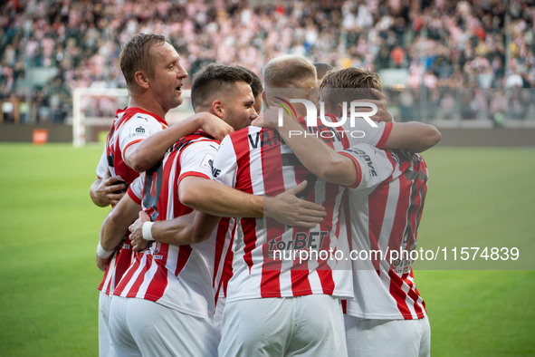 Cracovia players celebrate scoring a goal during the game between KS Cracovia and Pogon Szczecin in Krakow, Poland, on September 14, 2024. P...