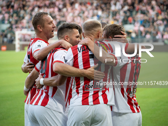 Cracovia players celebrate scoring a goal during the game between KS Cracovia and Pogon Szczecin in Krakow, Poland, on September 14, 2024. P...