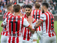 Cracovia players celebrate scoring a goal during the game between KS Cracovia and Pogon Szczecin in Krakow, Poland, on September 14, 2024. P...