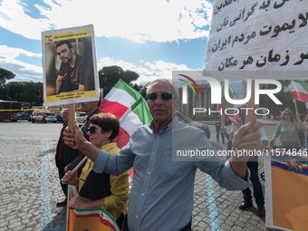 The Association of Iranian Graduates resident in Italy demonstrates on the anniversary of the killing of Mahsa Amini in Iran in Rome, Italy,...